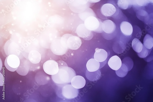 Purple bokeh lights with bright flare for festive background.