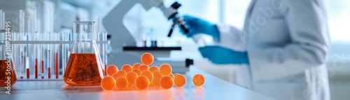 Advancing Material Science with Innovations in Nanomaterials, Laboratory scene featuring a researcher in a white coat using a microscope with glassware and orange liquids in the foreground.