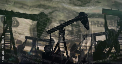 Image of financial data processing over oil rig and american dollar bill photo