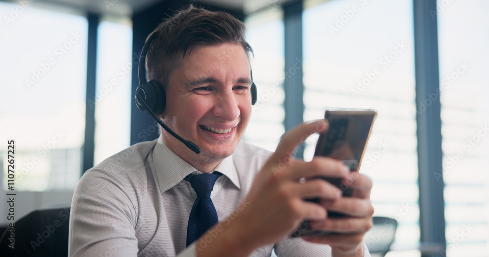 Happy man, headset and typing with phone at call center for communication, online help or web consulting at office. Japan, male person or agent with smile on mobile smartphone for language assistance Happy man, headset and typing with phone at call center for communication, online help or web consulting at office. Japan, male person or agent with smile on mobile smartphone for language assistance