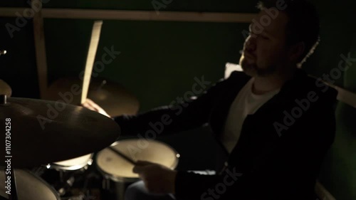 The musician plays the drums. Mysterious cinematic atmosphere