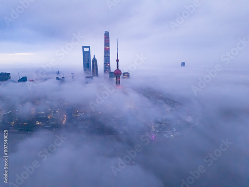 Aerial view of Shanghai skyline in the fog at sunrise