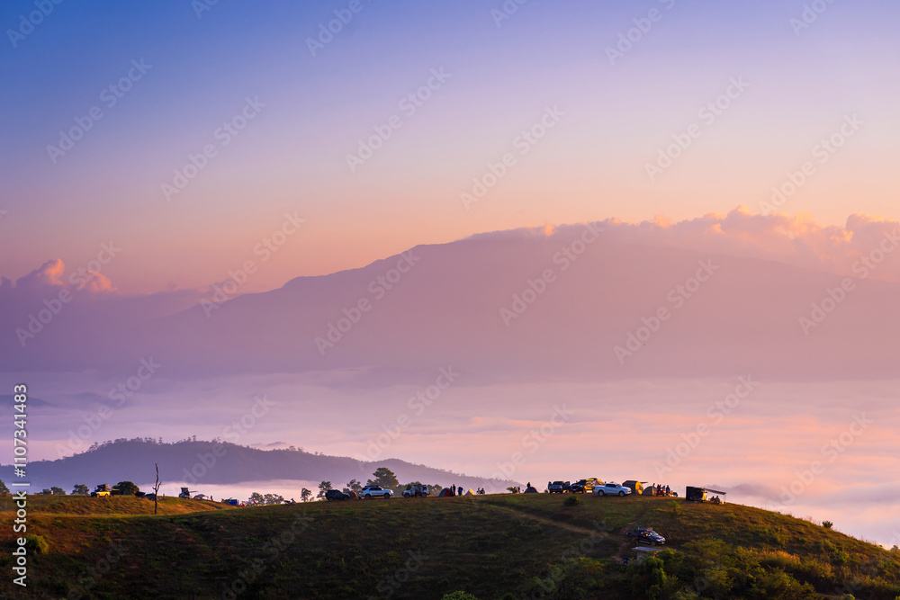 Beautiful scenery of the sea of mist in the morning at the Car Camping site with a viewpoint nature at Doi Ba Lu Kho Mountain in Mae Chaem, Chiang Mai, Thailand. Background concept. Beautiful scenery of the sea of mist in the morning at the Car Camping site with a viewpoint nature at Doi Ba Lu Kho Mountain in Mae Chaem, Chiang Mai, Thailand. Background concept.