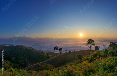 Beautiful scenery of the sea of mist in the morning at the Car Camping site with a viewpoint nature at Doi Ba Lu Kho Mountain in Mae Chaem, Chiang Mai, Thailand. Background concept. photo