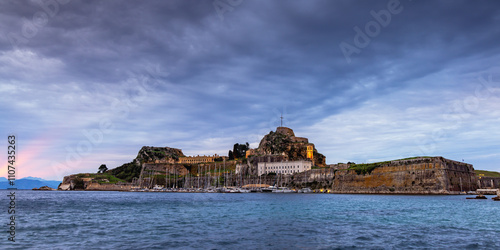 Sunrise view of Mandraki harbour and the Old Venetian Fortress, Corfu, Greece 