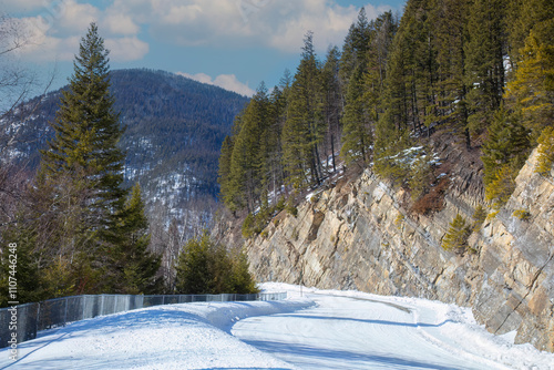 Snow covered mountain road in winter in Flathead National Forest, Montana, USA photo