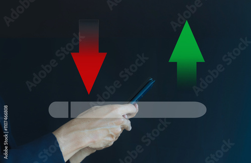Hand Holding Smartphone with Graphical Indicators of Increase and Decrease Over Dark Background Illustrating Financial Trends and Digital Communication Concepts