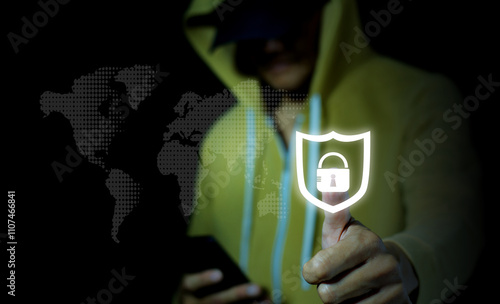 Concept of cybersecurity with a focus on data protection and online security represented by a person holding a shield icon against a digital world map background