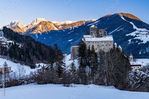 The castle Burg Heinfels in the austrian Alps at the austrian italian border in Sillian in winter sunset. photo