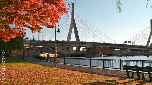 The iconic architecture of Boston in Massachusetts, USA showcasing the famous Zakim bridge spanning over the memorable Charles river on a sunny autumn morning. photo