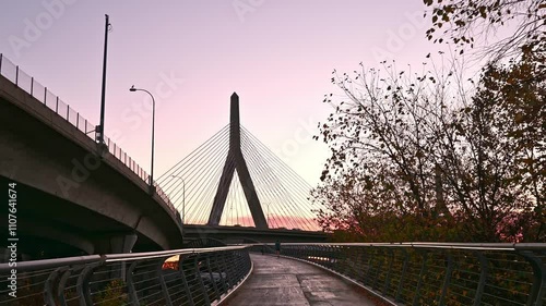 A timelapse of the architecture of the city of Boston at sunrise showcasing the iconic Zakim bridge on a sunny morning. photo