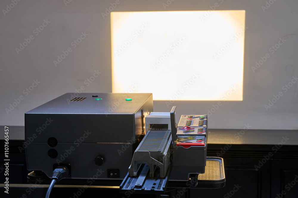Dual slide projector in use with picture on wall
