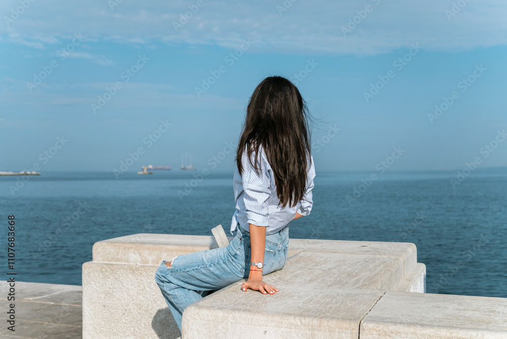 Beautiful traveler Woman looking the sea in Italy Beautiful traveler Woman looking the sea in Italy