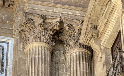 Detail of the sculpted heads of the columns of the Cathedral of the Incarnation, Malaga, Spain photo