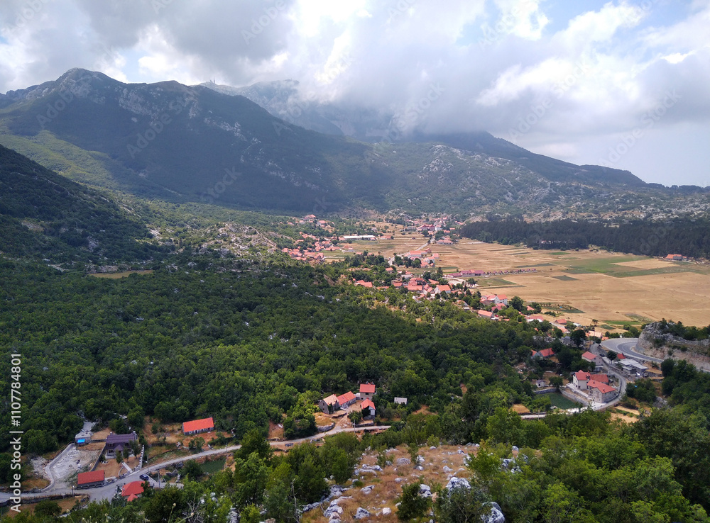Fototapeta premium Montenegro. Mountain landscape and village in the valley.