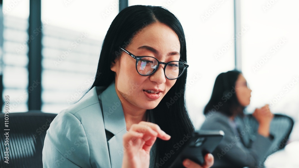News, Japanese or businesswoman with phone, app updates and social media for internet search. Online notification, check or accountant texting on mobile for chat, website and browse blog in office News, Japanese or businesswoman with phone, app updates and social media for internet search. Online notification, check or accountant texting on mobile for chat, website and browse blog in office