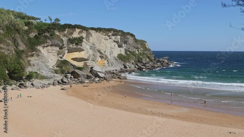 Sunny day on a Matalenas Beach in Santader, Spain photo