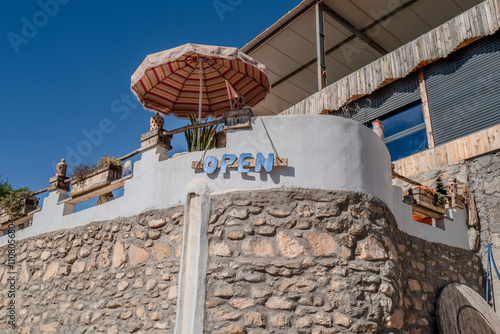 A bar on the beach in Morocco with an open sign