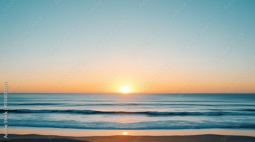 Obraz premium Sunset over tranquil ocean waves on a clear evening by the beach