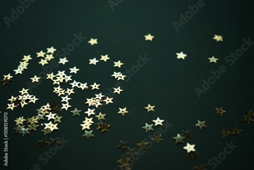 Background dark green with gold stars