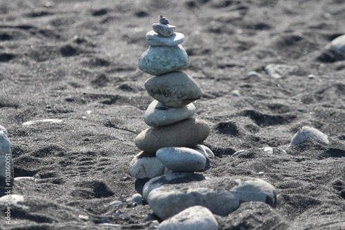 Balanced Rocks Forming a Small Tower on a Beach