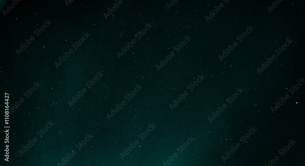 Obraz premium Starry sky with azure nuances of aurora borealis in the sky of Reykjavik, Iceland