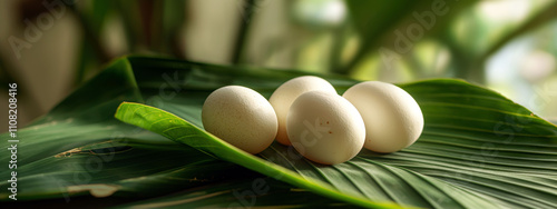 Presentation of traditional balut eggs on banana leaf in soft natural light photo