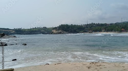  Close up of huge waves washing over the coastline and rocks.
