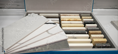 Furniture manufacturing Sample of artificial acrylic stone for kitchen countertops and other furniture. Stone texture for modern interior design.