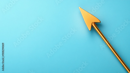 A golden arrow points upward against a vibrant blue background, symbolizing direction, growth, or progress in a simple and modern design. photo