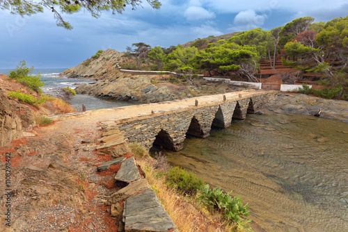 Coastal Path Over Pont des Sortell to S'Arenella Island, Cadaques, Spain photo