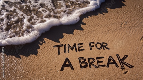 The message 'Time for a break' is written in the sand, with gentle waves washing over it, evoking relaxation. photo