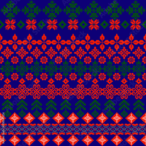 A vibrant, intricate pattern featuring floral and geometric designs in red, green, and blue, perfect for textiles or crafts.