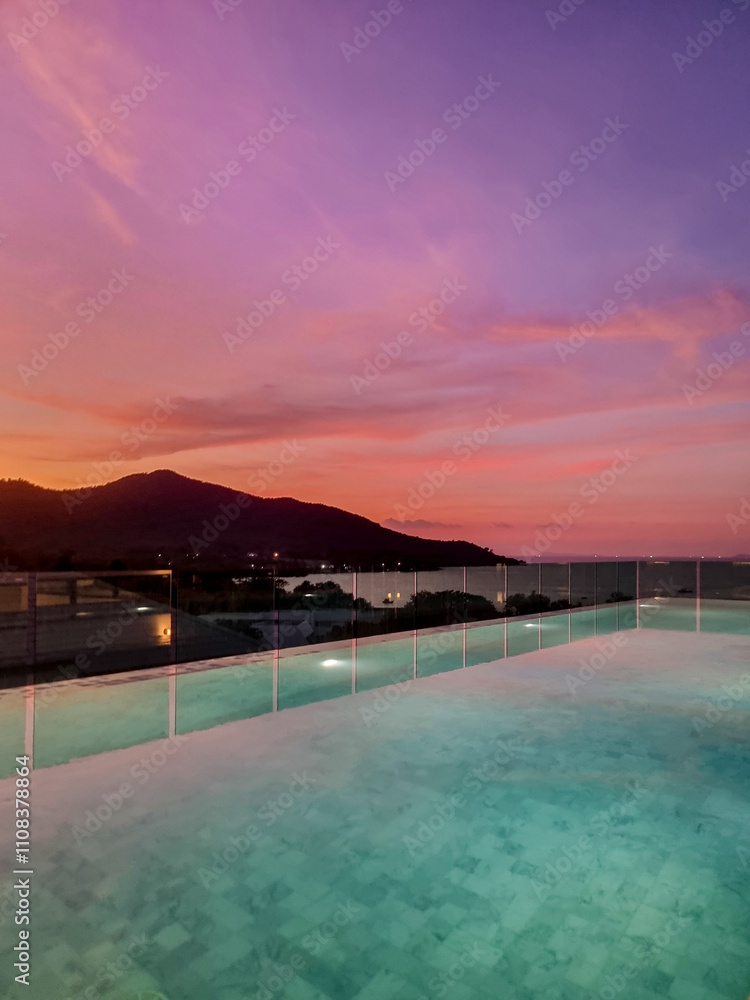 Fototapeta premium Serene sunset reflection over tranquil waters in Thailand