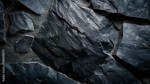 High-resolution photography of rustic black stone surfaces with natural imperfections.