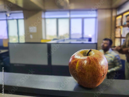 An Apple on a Cubical Separator: A Touch of Freshness in a Modern Office Environment