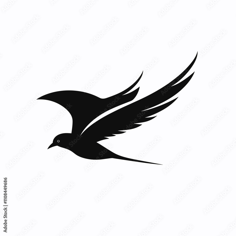 Fototapeta premium Elegant black silhouette of a bird in flight with detailed wings