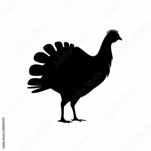 Silhouette of a turkey standing against a plain background in a simple pose