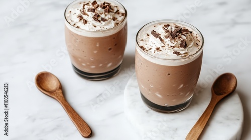 Chilled Cocoa with Whipped Cream and Chocolate Shavings Served in Minimalist Style on Marble Table.