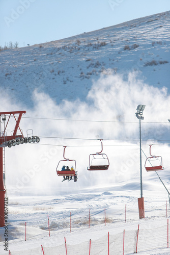 Mongolian snow skiing Resort in Ulaanbaatar. Young boys skating on hoverboard.