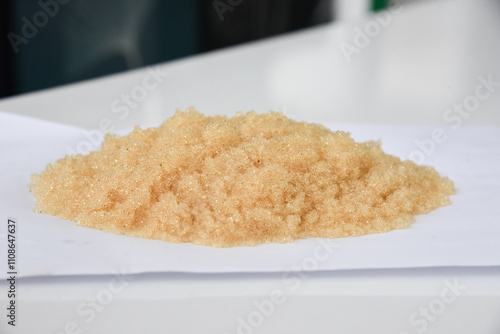Microbeads of ion-exchange resin (ion-exchange polymer) Wet resin filtration for water purification on white background
