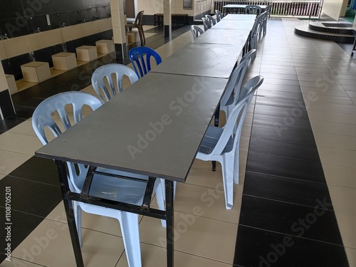 Dining hall with tables and chairs inside a mosque in  a  city in Malaysia
 photo