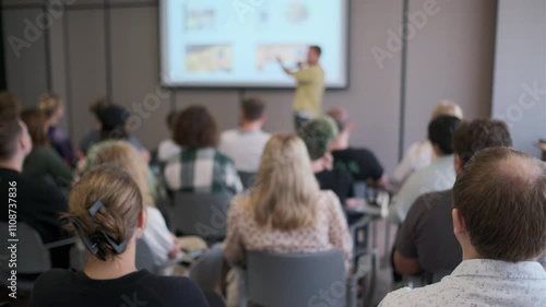 Wallpaper Mural Focused group of people attending a presentation session in a modern conference room, highlighting teamwork and professional learning. Torontodigital.ca
