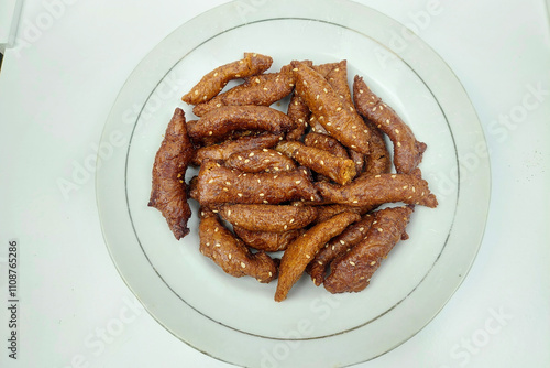 Deppa Tori, Beppa tori, cicuru or deppa tektekang is a traditional Indonesian snack made from brown rice mixed with brown sugar and water and then baked. photo