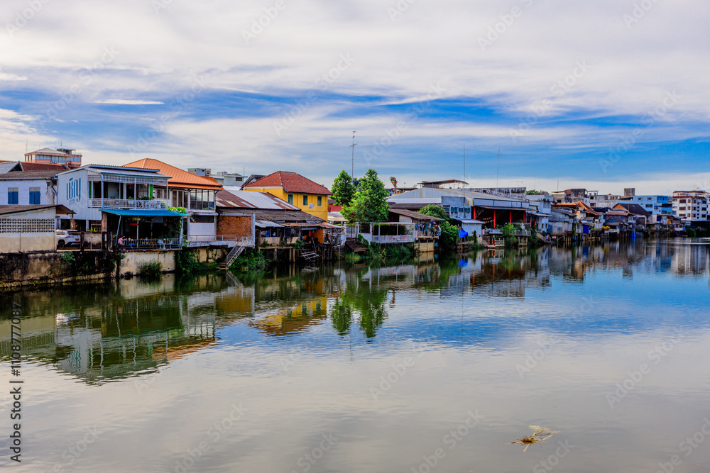 Fototapeta premium Background of the tourist attractions along the Chanthaburi River, a beautiful old Christian church, located in the middle of the community and travelers always stop by to admire its beauty.