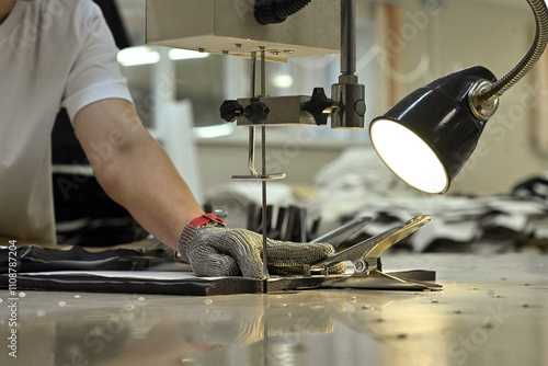 sewing factory sew fabric seamstress knitwear wool hands toy slippers red sewing machine iron ironing blue pattern templates needles carpets scissors cut lamp