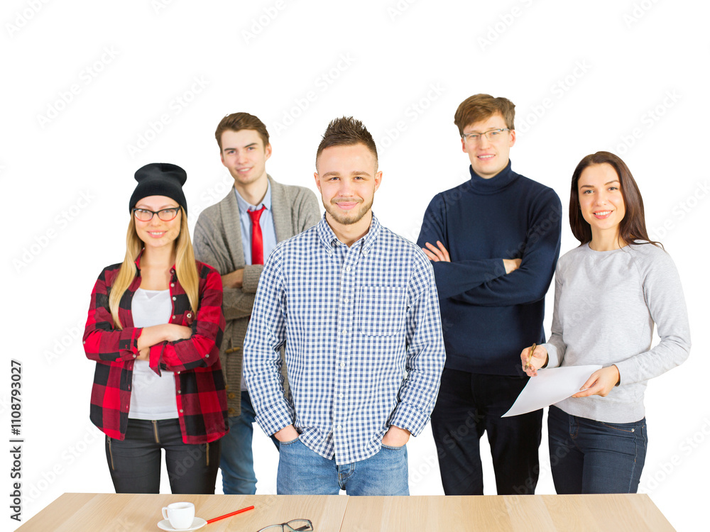 © peshkova - A group of young professionals standing together, smiling confidently near a table. Isolated on a white background. Concept of teamwork and collaboration