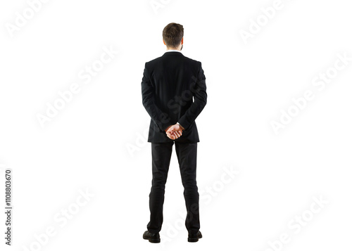 Photos Rear view of a businessman in a formal suit standing with hands clasped behind his back, isolated on a clean white background