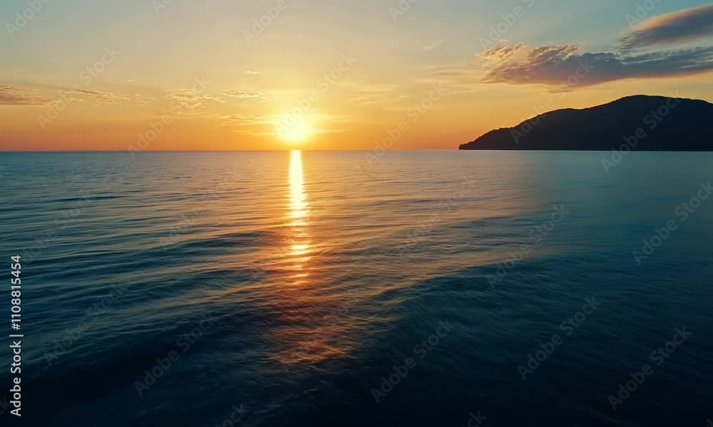 A serene sunset over calm waters, reflecting warm colors and creating a tranquil atmosphere. A serene sunset over calm waters, reflecting warm colors and creating a tranquil atmosphere.