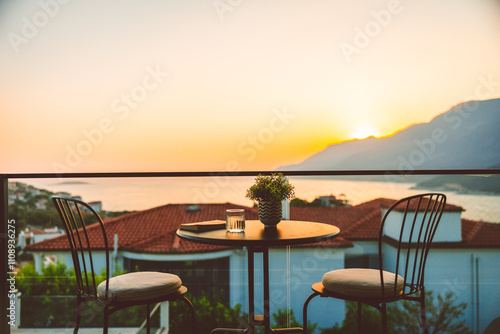 Relax and enjoy the stunning sea view from a cozy balcony with a glass of wine